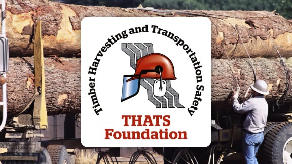 loggin safety logo and logging truck in background